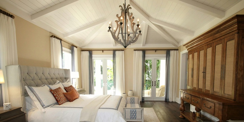 Cozy upholstered bed beside a stylish cabinet in a modern bedroom setting.