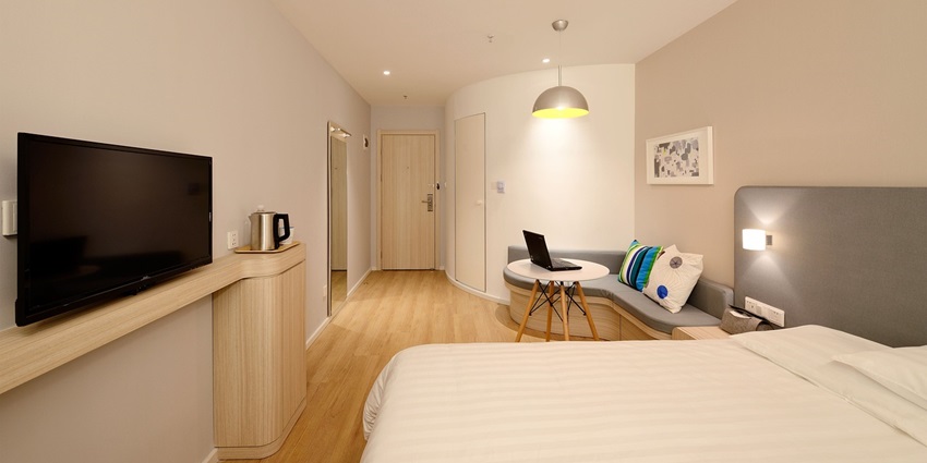 Modern bedroom interior design with cosy decor, offering a comfortable and relaxing setting