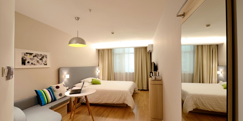 View of a hotel room near Ulakkai Aruvi Waterfall offering comfortable stays for guests.