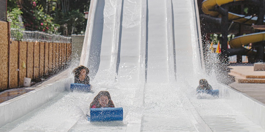 Exciting water slides in a vibrant water park, inviting adventure and fun