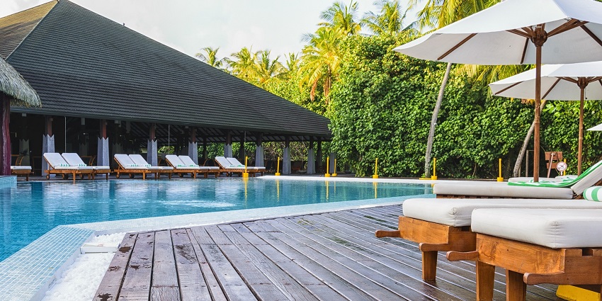 A tropical beach resort with palm trees, one of the best attractions near the wildlife Sanctuary.