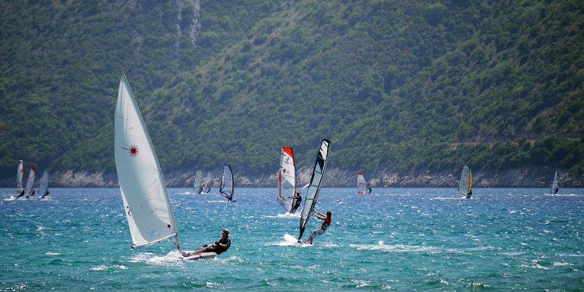 An image of a windsurfer skillfully riding the waves, one of the best water sports in Mumbai.