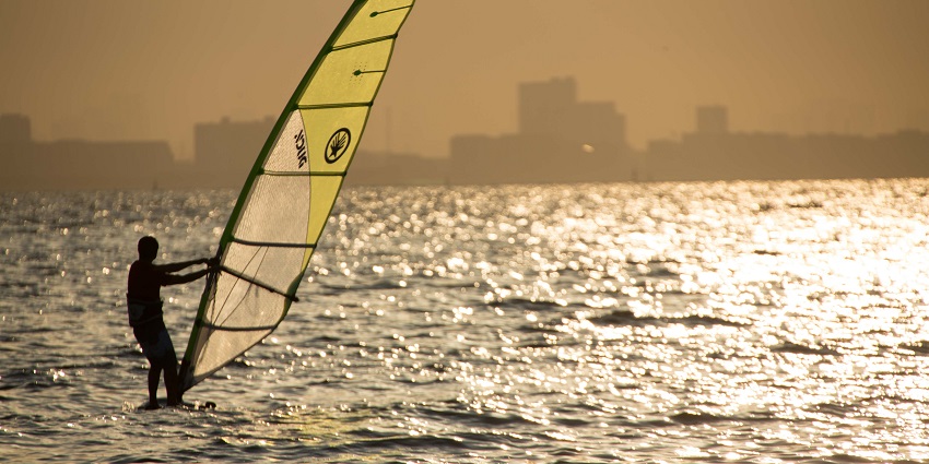 Exciting windsurfing experience for adrenaline seekers on waves.
