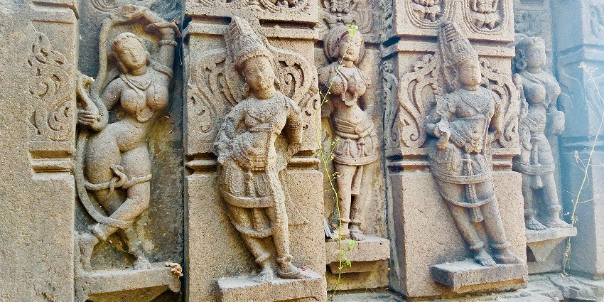 An image of lord Suryanarayana temple with ornate carvings and architectural details.
