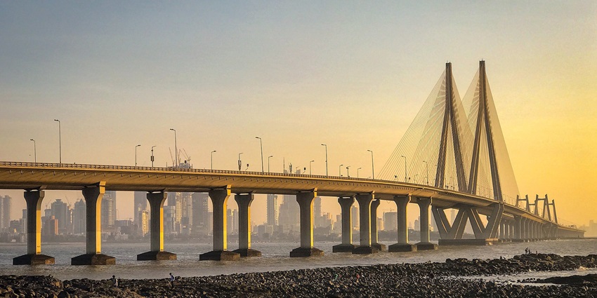 An image view of the Worli Sea Link illuminated against the night sky, which is among the top places to visit near Gateway of India.