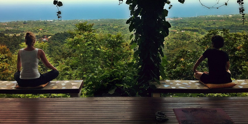 The two women enjoy the weather and view and practise yoga in a private studio.