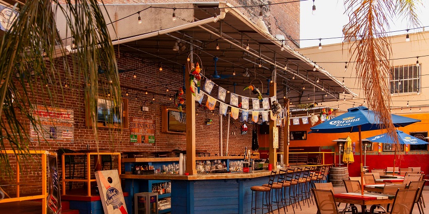 Trendy bar on the roof with a lively vibe, music, and cocktails