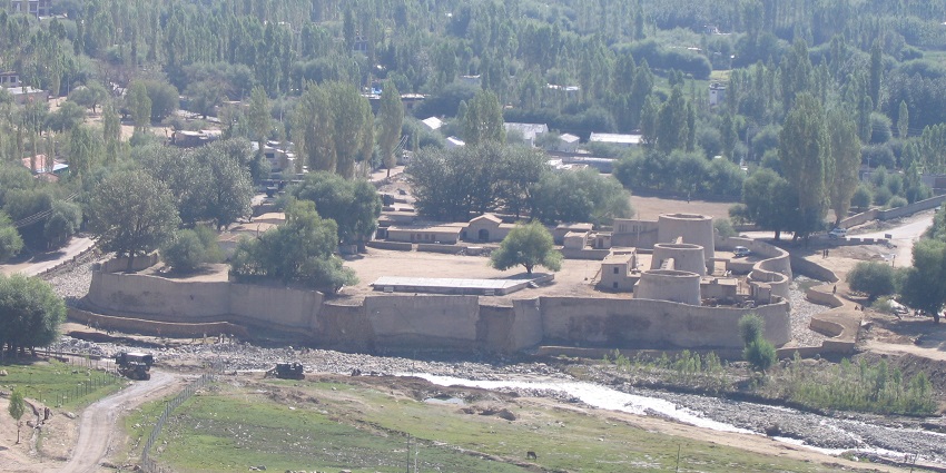 A breathtaking view of the Zorawar Fort surrounded by lush greenery during the daytime.