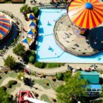 A view of one of the Badlapur water parks, showcasing thrilling rides and greenery.