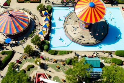 A view of one of the Badlapur water parks, showcasing thrilling rides and greenery.