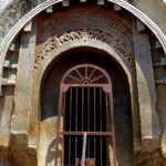 A panoramic view of Barabar Caves in Jehanabad, Bihar, with intricate carvings.