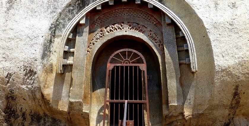 A panoramic view of Barabar Caves in Jehanabad, Bihar, with intricate carvings.