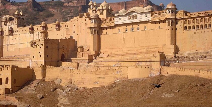 A distant view of Khandar fort with thick walls situated on the edge of a hill.