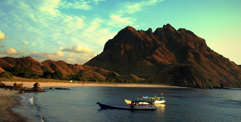 A picture of Komodo National Park, terrain rough and waters clear enough.