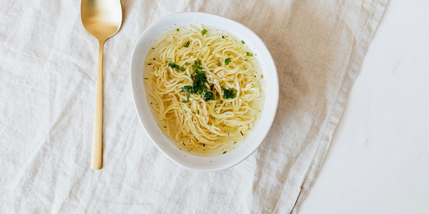 The best street food in Pondicherry is creamy noodle soup topped with garnishes.