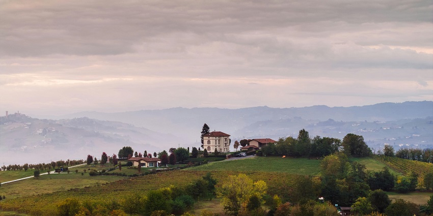 View of a countryside villa surrounded by vast lush landscapes