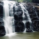 A serene view of Abbey Falls, one of the popular places to visit in Coorg, Karnataka.