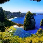 The view of this sland from inside a cave with rugged cliffs, one of the best places to visit in Nusa Penida.