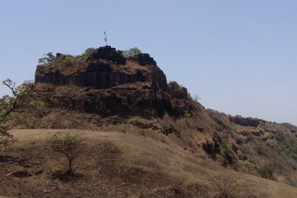 Rangana Fort, surrounded by dense vegetation and hills, a historic tourist attraction near Maharashtra.