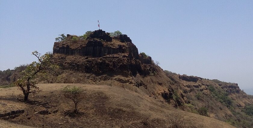 Rangana Fort, surrounded by dense vegetation and hills, a historic tourist attraction near Maharashtra.