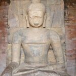 Inner view of a shrine showcasing the statue of Shakyamuni along with the bodhisattvas