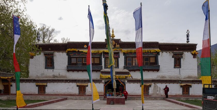 A breathtaking frontal view of a colourful monastery in Ladakh during the daytime.