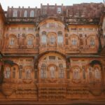 View inside the courtyard of Songiri fort, showcasing detailed architecture under a clear blue sky