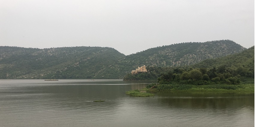 Siliserh Lake, surrounded by lush greenery of the Aravalli Mountains.