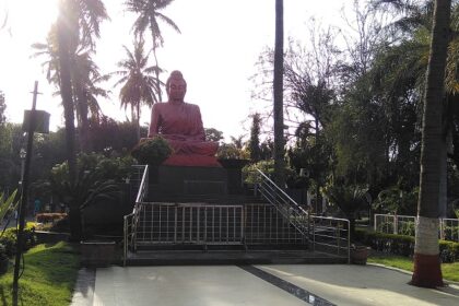 Buddha statue in Siddhartha Garden and Zoo, showcasing peaceful surroundings and nature.