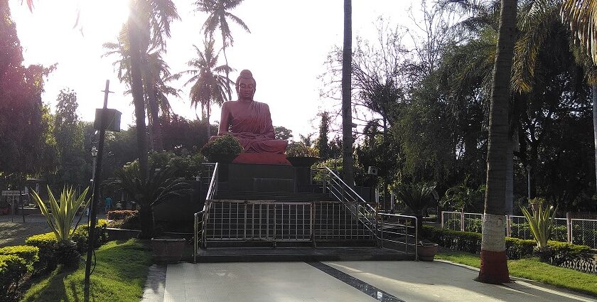 Buddha statue in Siddhartha Garden and Zoo, showcasing peaceful surroundings and nature.