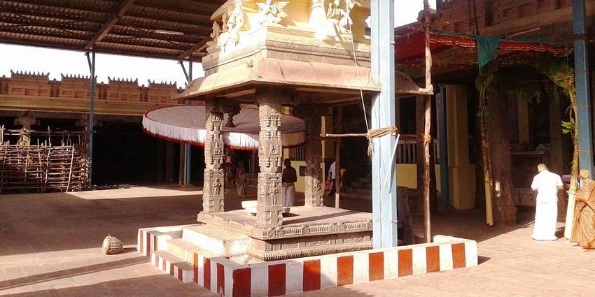 The door leading to the main idol with a structure in front with intricately carved pillars.