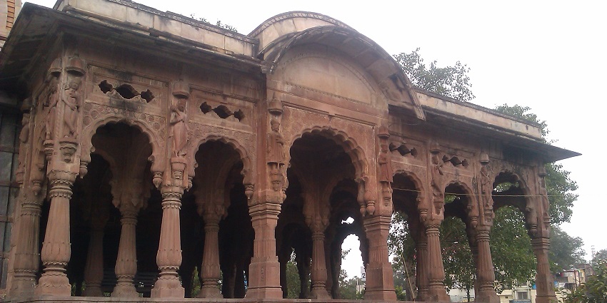 Chhatri of Krishnabai temple, with detailed carvings on the brown walls