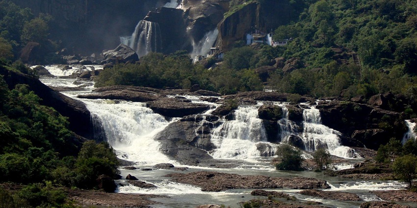 Waterfall cascading through lush Western Ghats greenery, Tamil Nadu