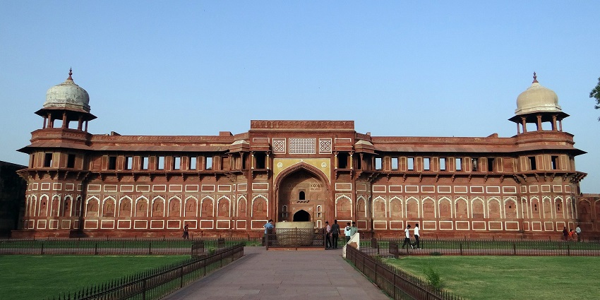 A picture of the historic Fort, featuring red sandstone walls in the daylight.
