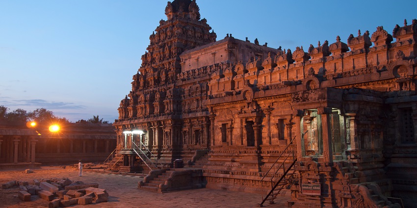 Airavatesvara Temple with Dravidian architecture lit up with few lights in the evening