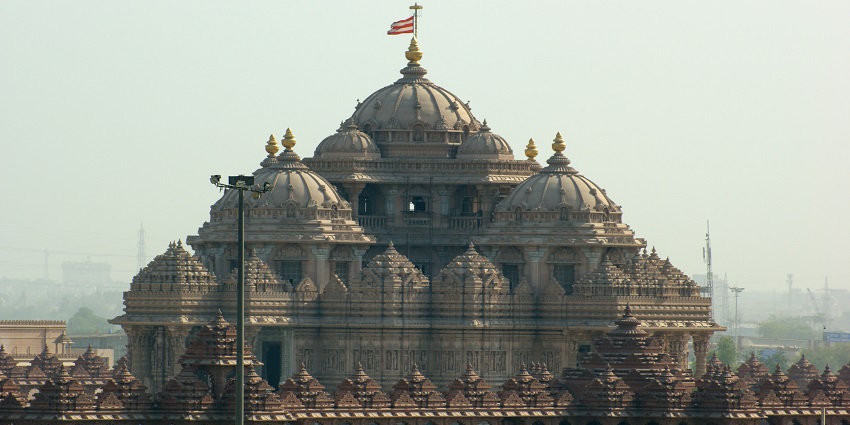 A view of Akshardham Temple with carvings on sandstone walls near Okhla Wildlife Sanctuary.