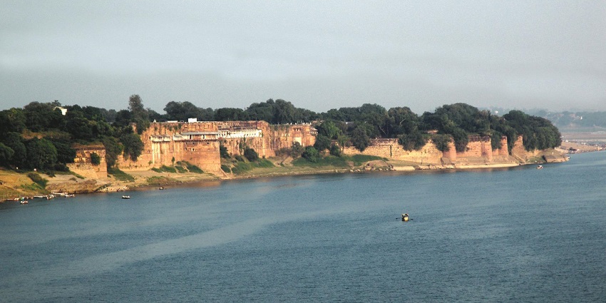 The majestic Allahabad Fort overlooking the confluence of the rivers, with historical architecture.