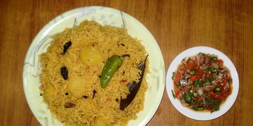 Allahabadi Tehri, a rice dish, served with pickle at a famous place in Allahabad