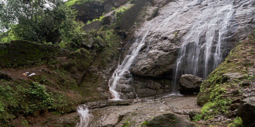 Picturesque view of the Ambakhori waterfalls, one of the best attractions near Adasa temple