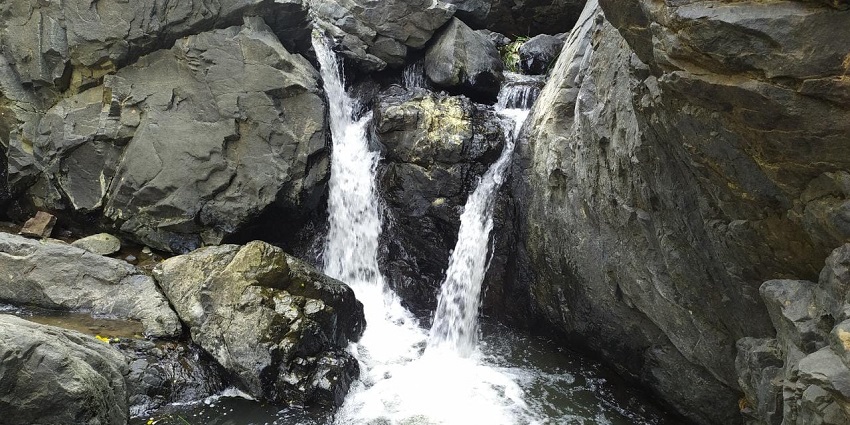Small fall between the rocks at Amirthi Falls Zoological Park, one of the best tourist places in Vellore