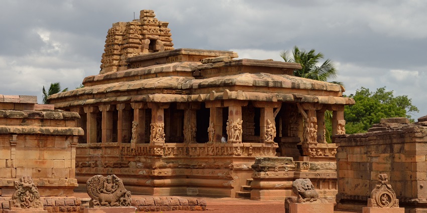 An ancient rock-cut Durga temple with beautiful carvings on its walls and pillars.
