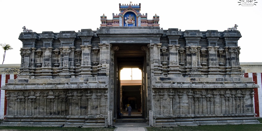 Kailasanathar Temple’s outer view, showing its stone walls, and a gateway to the main temple.