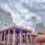 View of Arunachaleswara Temple showcasing towers and pillar structure and people worshipping