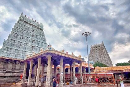 View of Arunachaleswara Temple showcasing towers and pillar structure and people worshipping