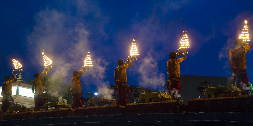 Morning arti on Assi Ghat near Ramnagar Fort, a serene oasis in Varanasi.