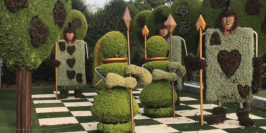 The Wonderland Exhibit showing a chess board and the pieces made of grass