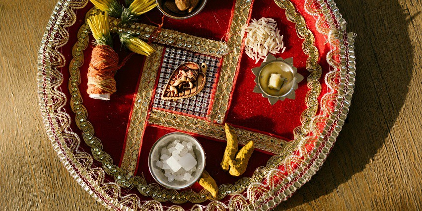 Image of a pooja thali, filled with all the essential ingredients