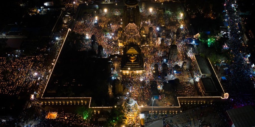 Aerial view of a decoration of a temple illumination with LED string lights and earthen lamps