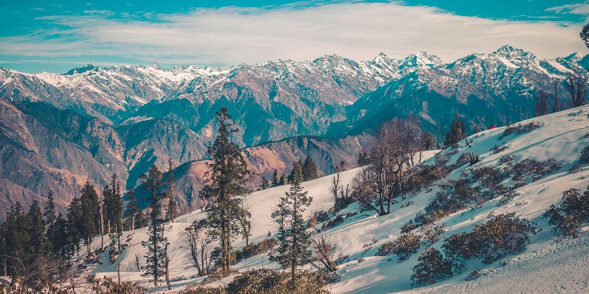 Beautiful snow-capped mountains at Auli offer a perfect getaway to nature lovers.