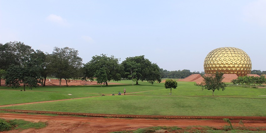Auroville, a must-visit place in Pondicherry, shows the iconic golden Matrimandir dome.